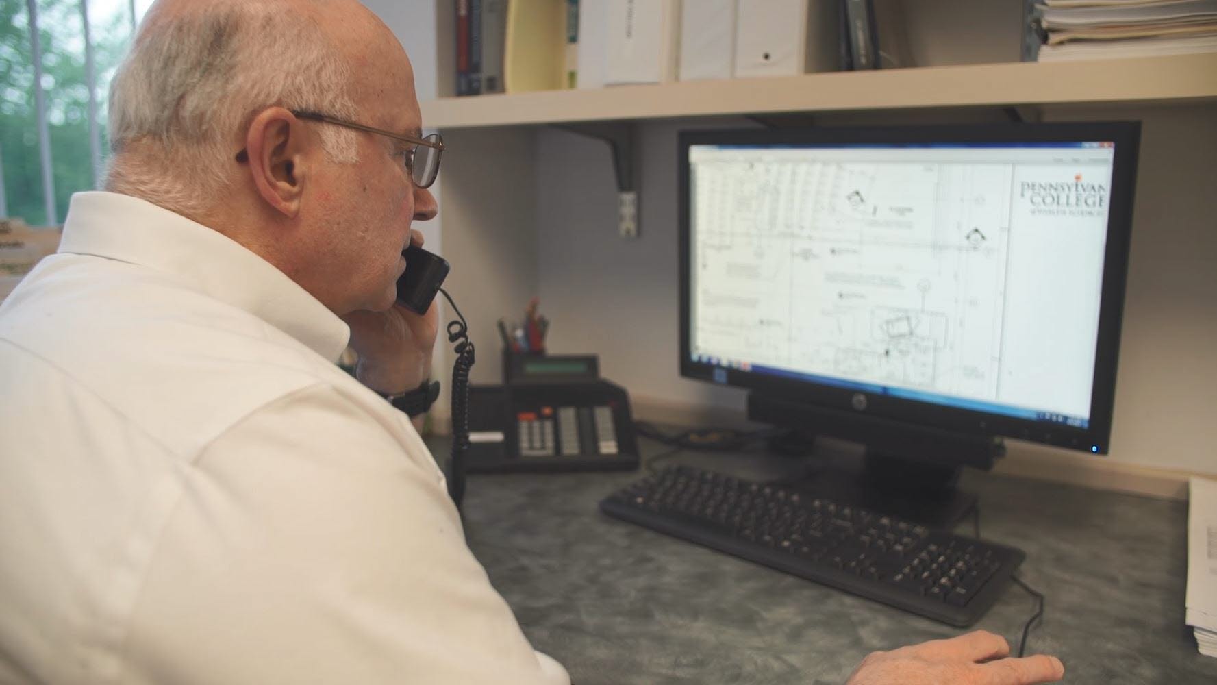 Tom at computer still image from 215 2016 PA College Forum Master.JPG